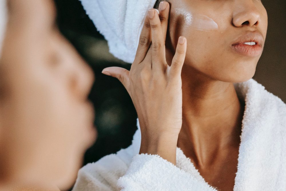 woman applying skin cream